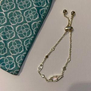 Kendra Scott gold bracelet in dusty pink